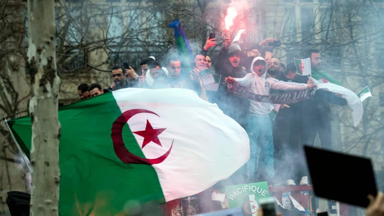 Members of the Algerian community in Paris protest against the fifth term of Algerian President Abdelaziz Bouteflika on Place de la Republique in Paris, France (AAP)