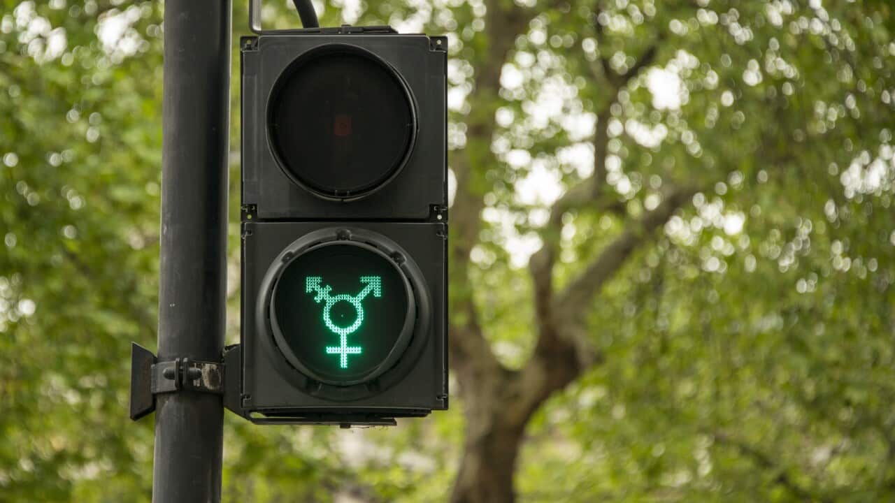 LGBT pedestrian traffic light signals symbolising equality, diversity and tolerance, London, UK