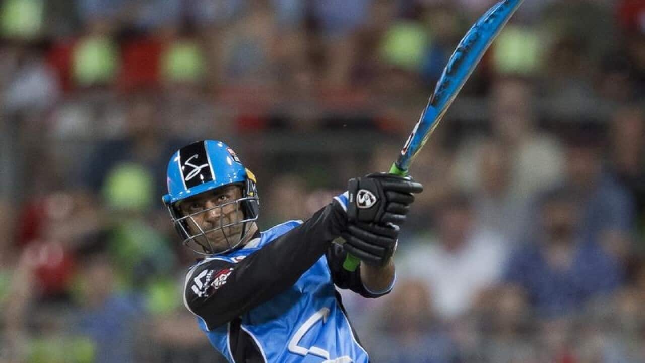 Rashid Khan of the Strikers hits a 6 during the Big Bash League.