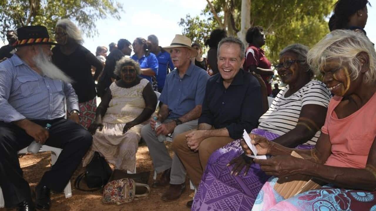 Pat Dodson (left) and Bill Shorten speak to Tiwi Island elders.