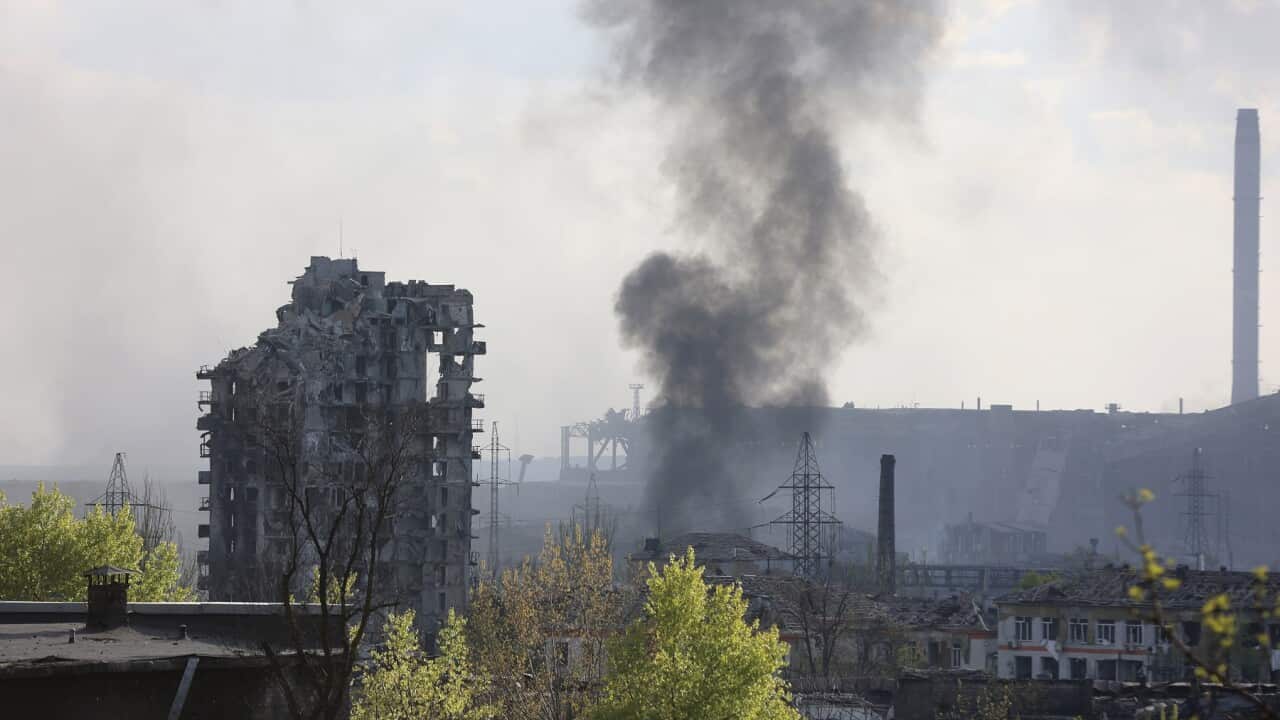 Smoke rises from the Metallurgical Combine Azovstal in Mariupol, in territory under the government of the Donetsk People's Republic, eastern Ukraine, Wednesday, May 4, 2022. (AP Photo/Alexei Alexandrov)