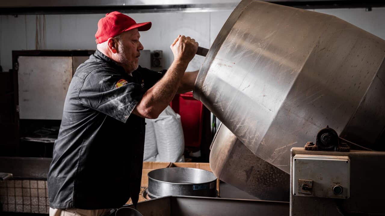 Jimmy Alfiouny working the nut roasting machines at his facility.