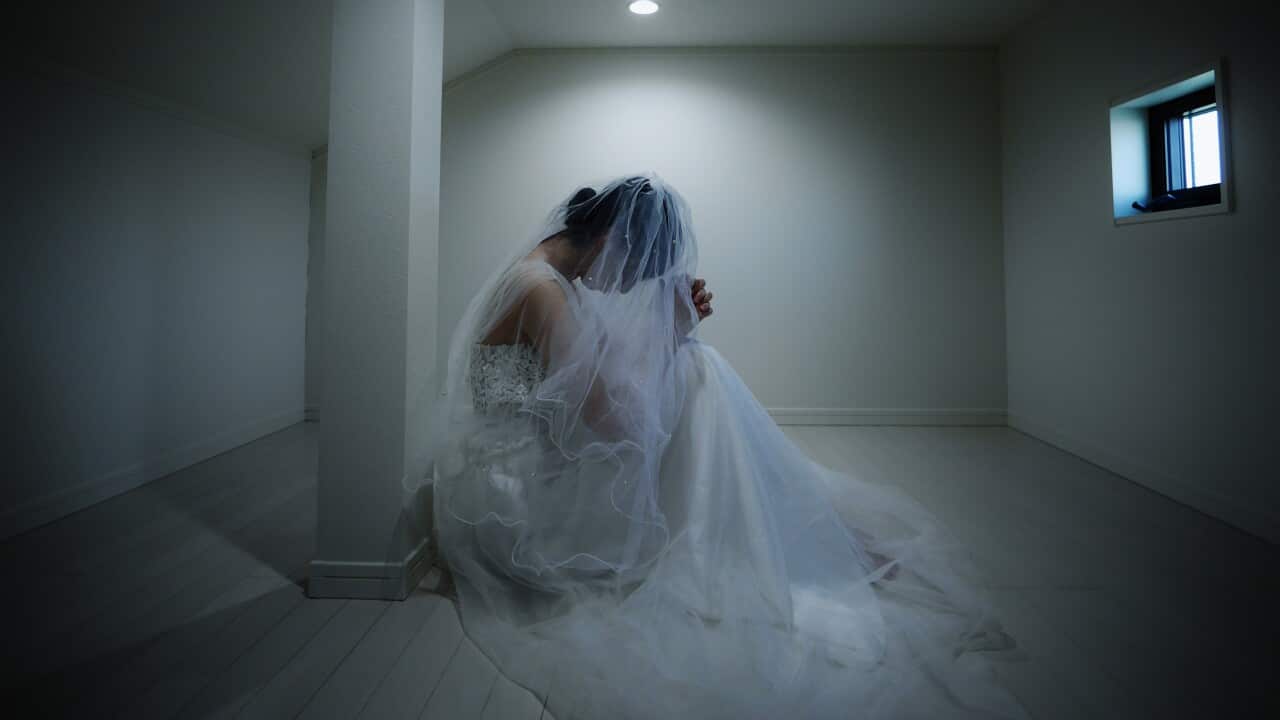 Bride praying in the attic