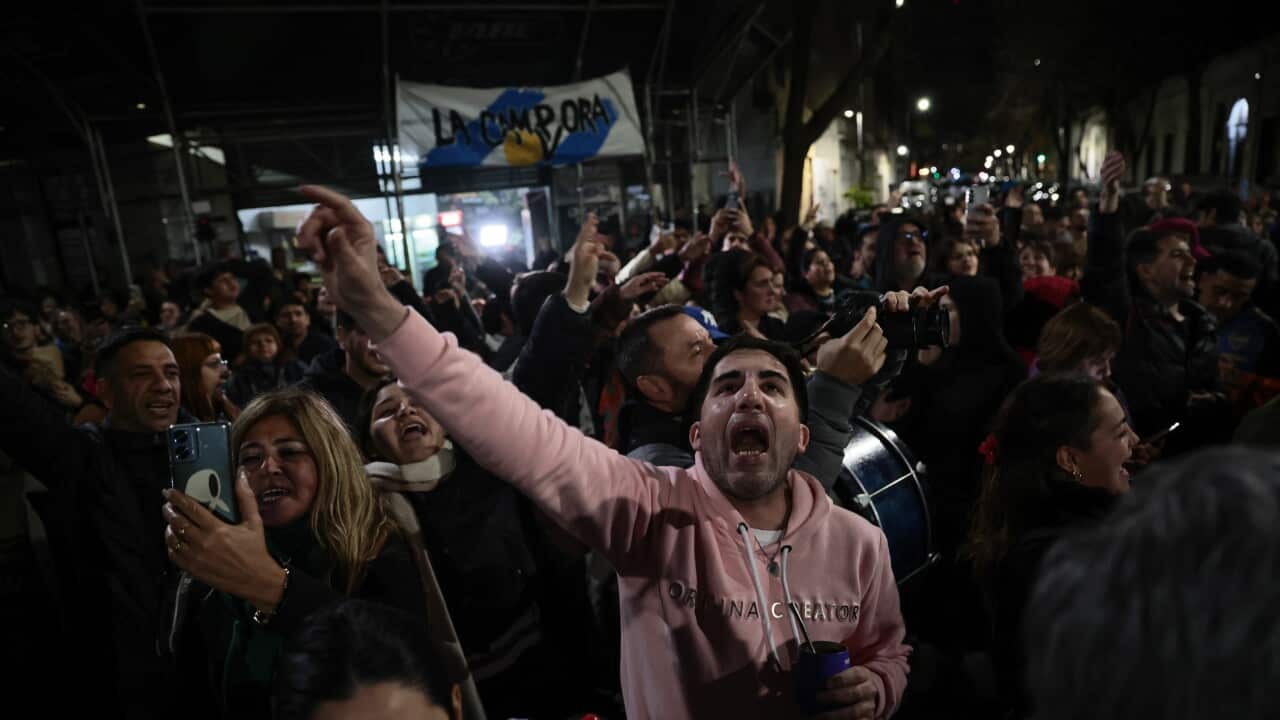 Former president Cristina Fernandez celebrates the Peronist victory in recent elections from her balcony