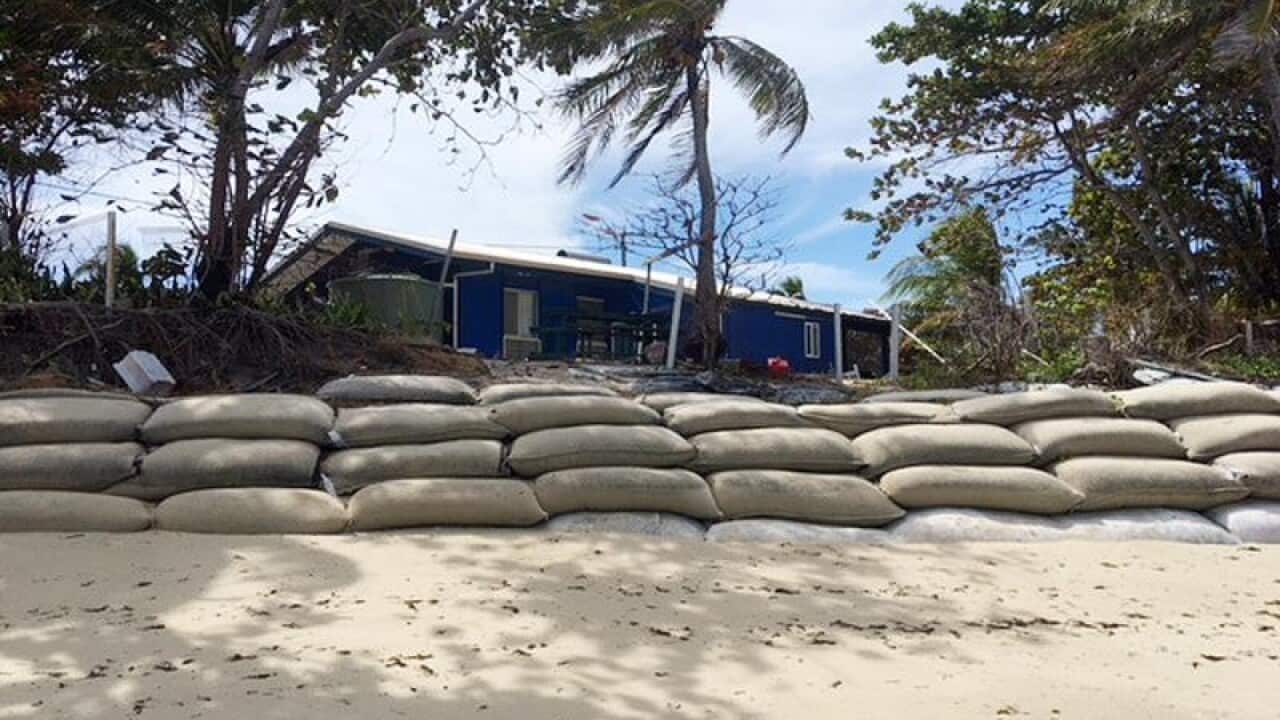 A metre-high wall of sandbags on Poruma Island