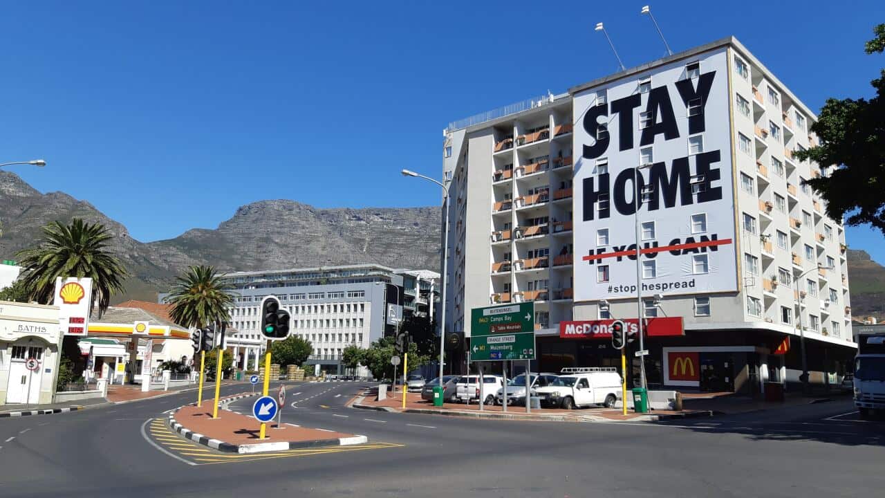 A billboard on the building at the corner of Long Street and Orange Street in Cape Town, South Africa calls on South Africans to "Stay at Home" during the lockdown period to help government's efforts to contain the pandemic.