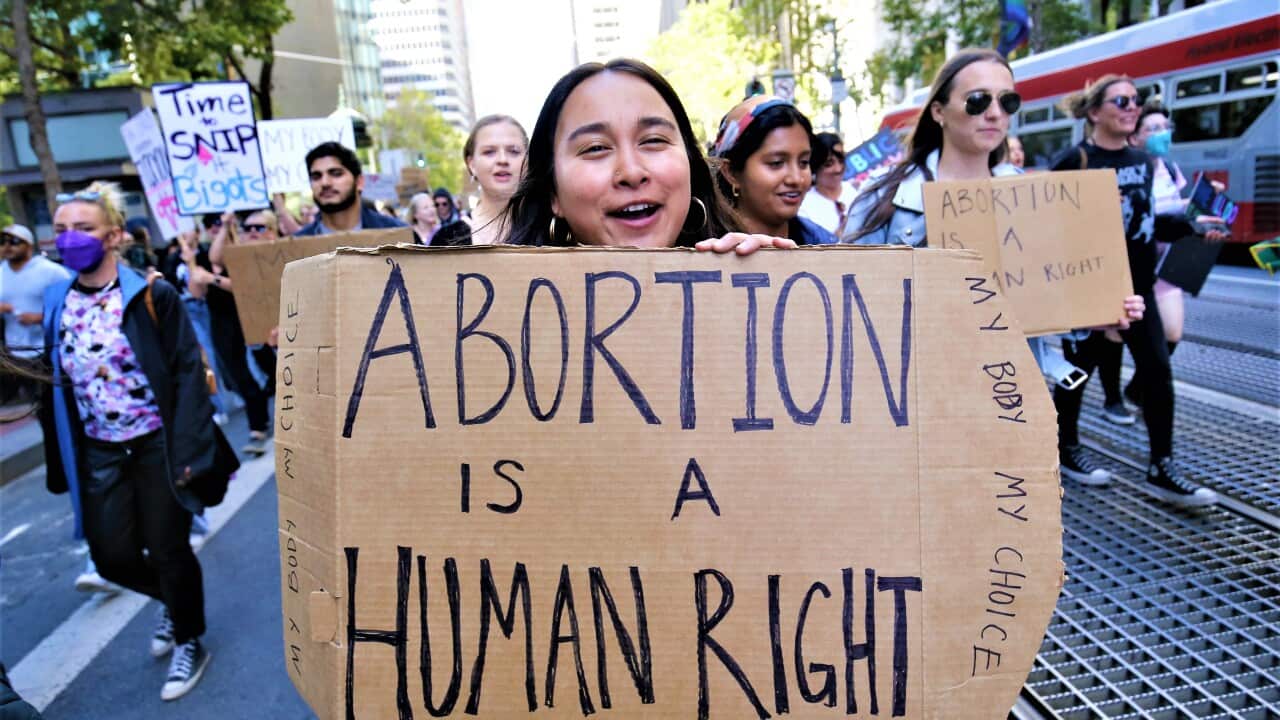 A protester holds a placard reading " Abortion is a Human Right" during the demonstration. In San Francisco, hundreds of protesters took to the streets with placards, they want to uphold their abortion right and they think abortion or not should be decide