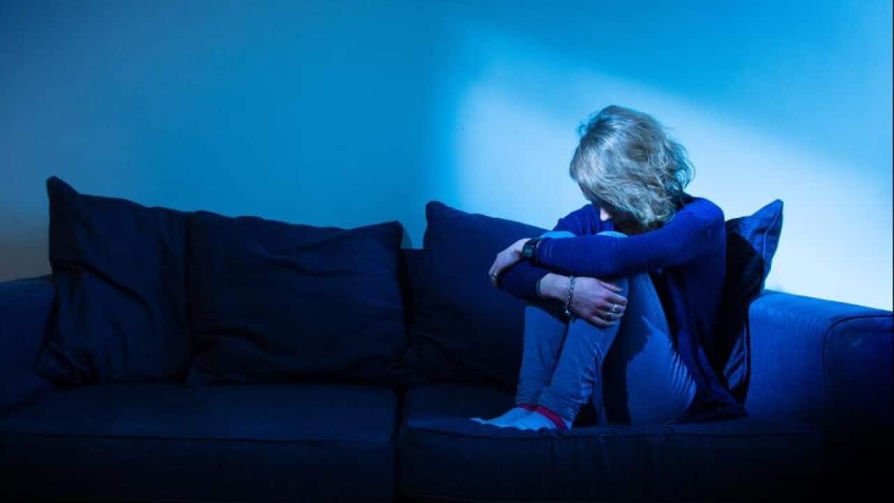 A model poses for a picture to represent mental illness