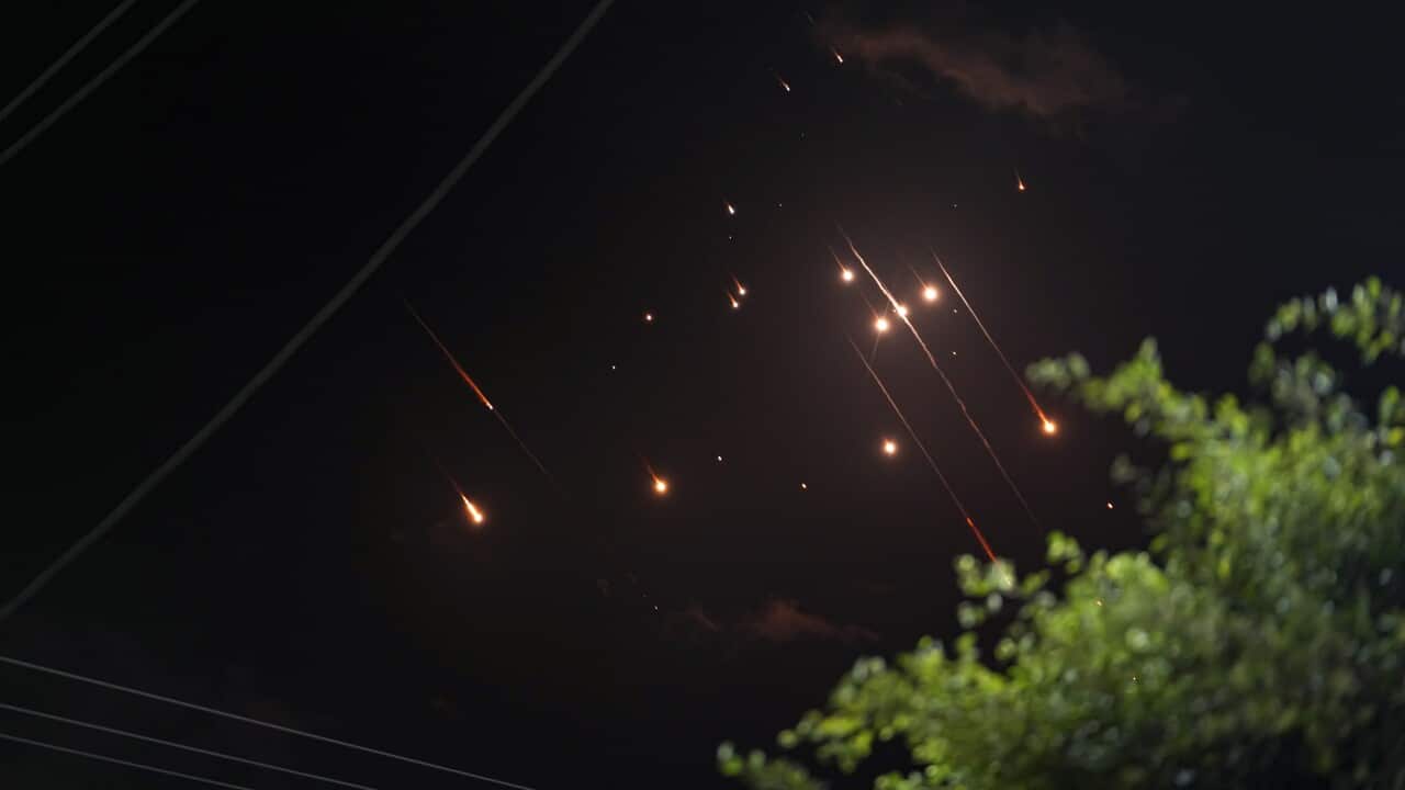 Missiles flying across the night sky.