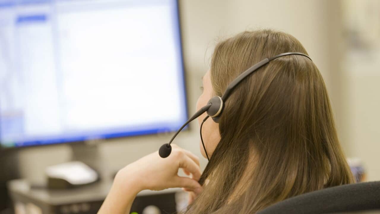 Woman in call center on phone