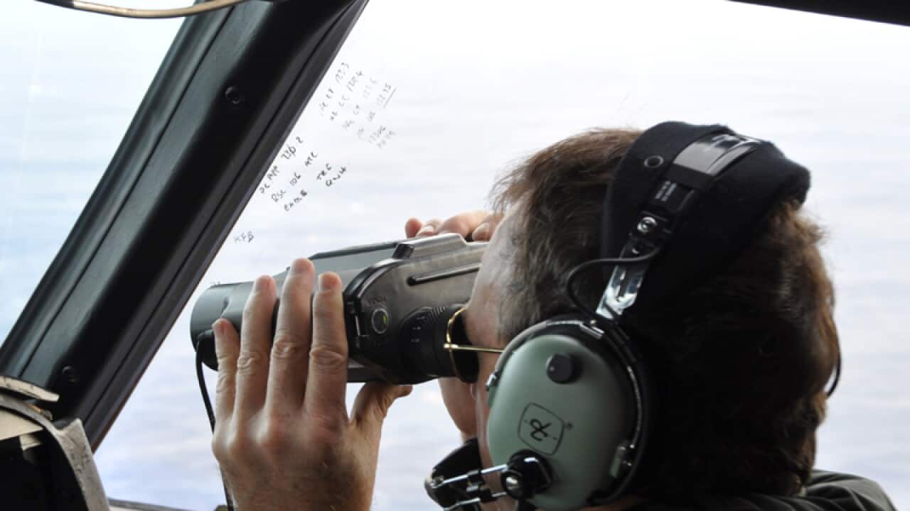 A Royal NZ Air Force plane searches for the missing Malaysia Airlines