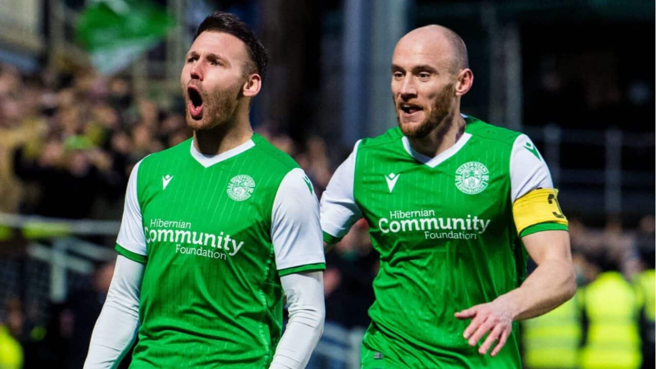 Martin Boyle (L) celebrates a goal for Hibernian