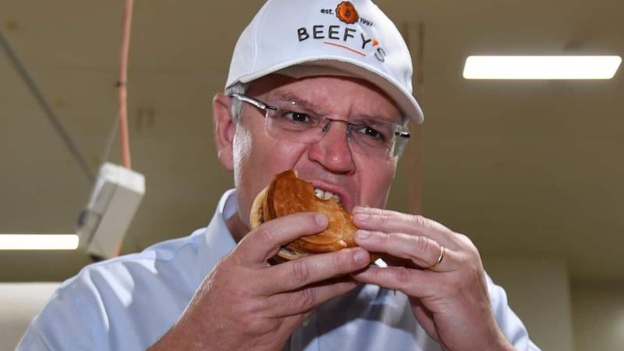 Scott Morrison eats a pie