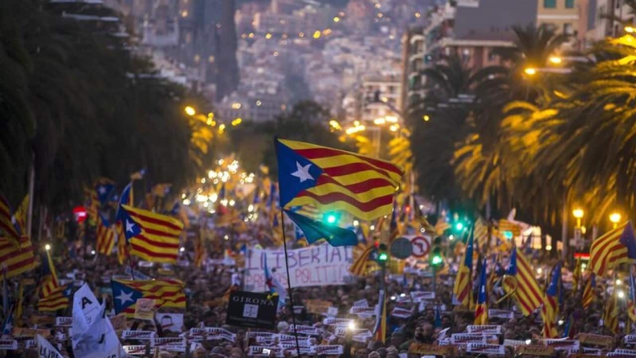 Demonstrators wave so-called 'Estelada' Catalan independence flag.