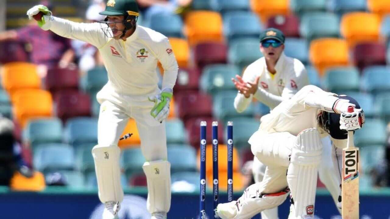 Tim Paine of Australia is seen stumping out Moeen Ali of England