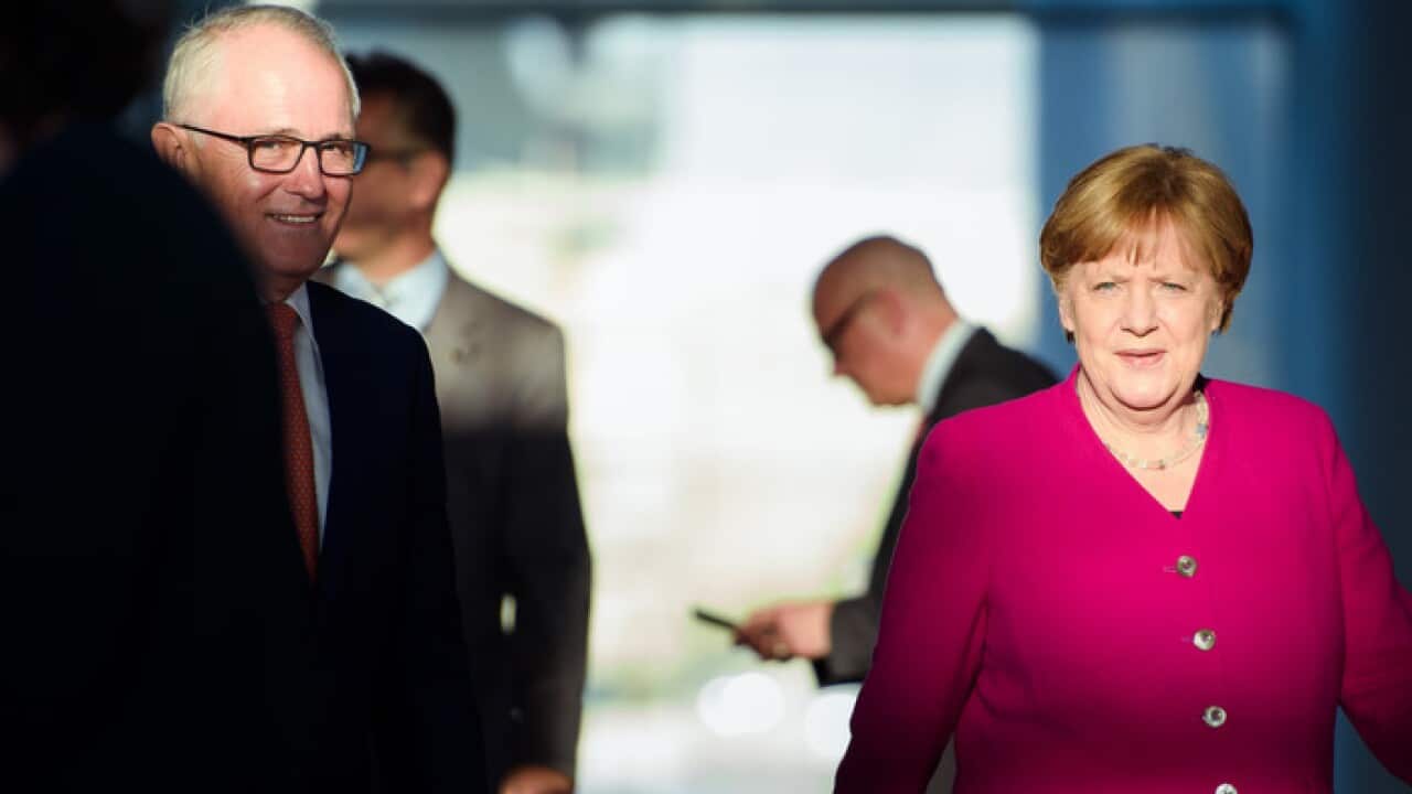 German Chancellor Angela Merkel (R) and Australian Prime Minister Malcolm Turnbull arrive to attend a press conference at the German Chancellery in Berlin, Germany, 23 April 2018.