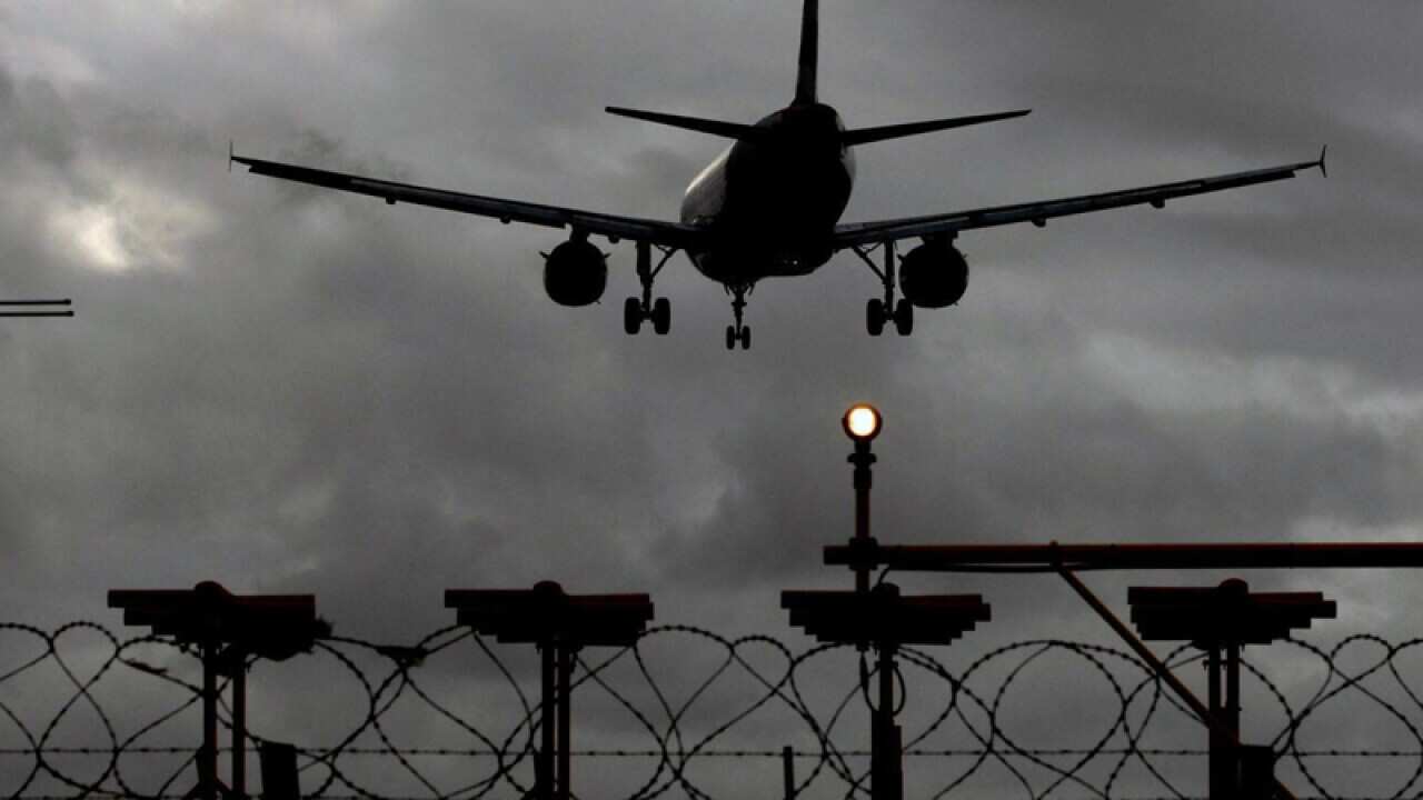 A plane lands at Heathrow Airport