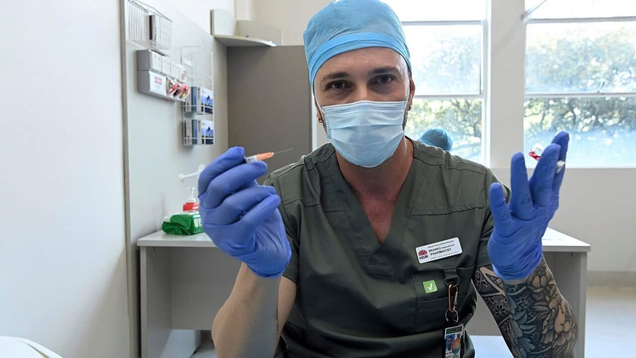 Pharmacist Blanko Radojkovic prepares a simulated vaccine at the Sydney Local Health District Vaccination Hub