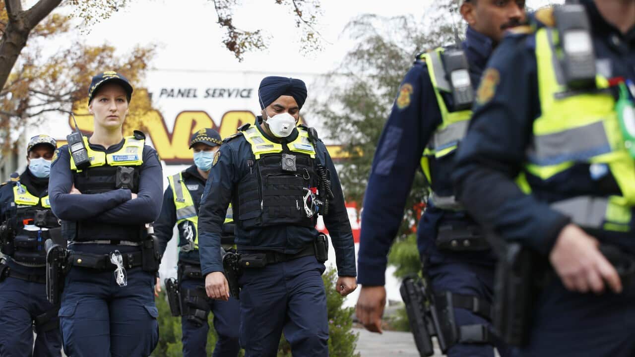 Police patrols outside public housing towers in Melbourne.