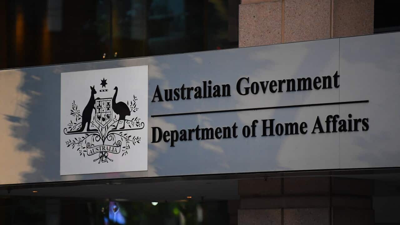 A sign that reads Australian Government Department of Home Affairs, with an Australian national emblem