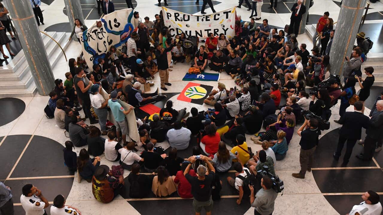 Aboriginal and Torres Strait Islanders protesting in the Marble Foyer at Parliament House in Canberra.