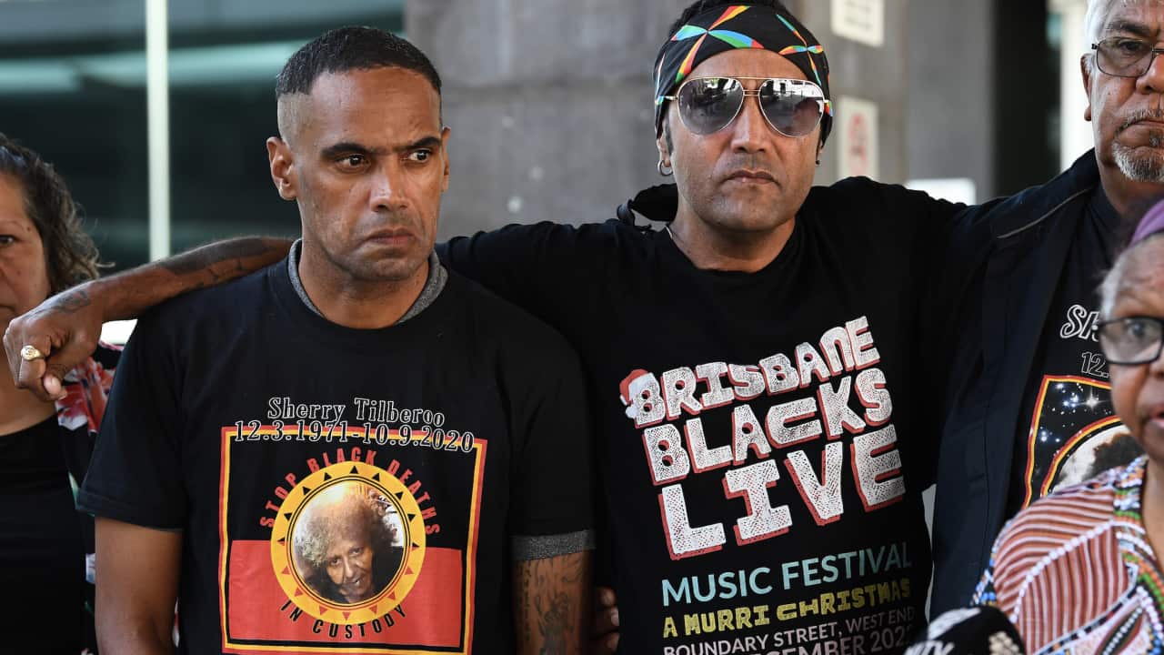 Jungaji Brady (right) talks to the media with family and supporters representing Shiralee Tilberoo, outside court, during a joint inquest for two Indigenous women who died in custody, Brisbane Coroners Court, in Brisbane, Tuesday, March 7, 2023.