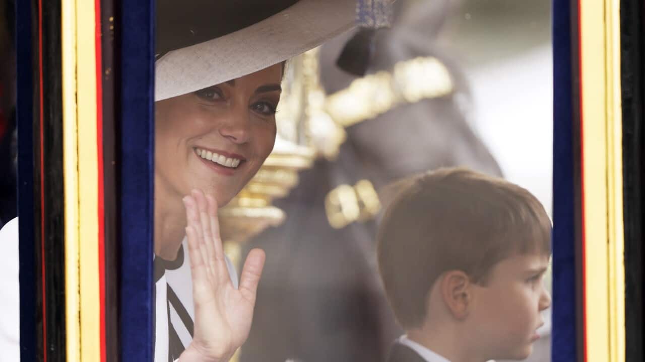 Kate Middleton waves with her youngest son alongside her.