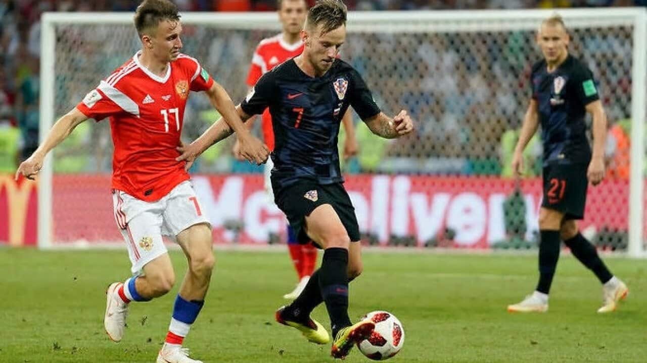 Russia's Fyodor Smolov leaves the pitch after losing the quarterfinal match between Russia and Croatia, 8 Jul 2018 – AAP.