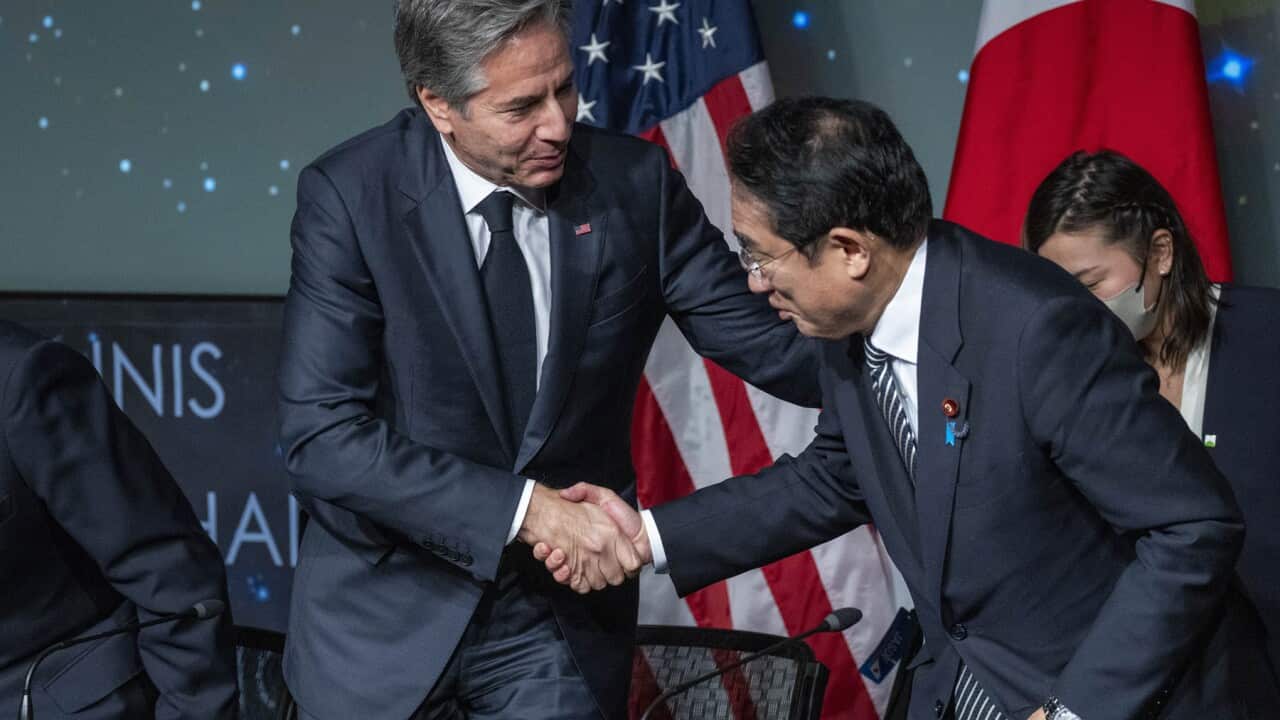 US Secretary of State Antony Blinken shakes hands with Japan's leader Fumio Kishida