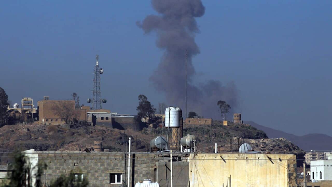 Smoke rises above the city following airstrikes