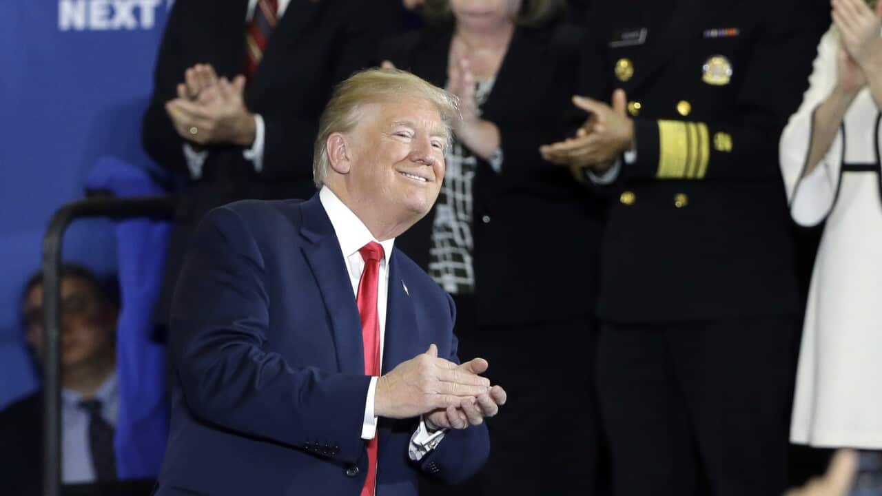 President Donald Trump receives applause after speaking about his plan to combat opioid drug addiction at Manchester Community College, Monday, March 19, 2018, in Manchester, N.H. (AP Photo/Elise Amendola)