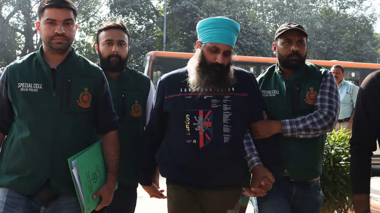 Delhi Police Special Cell officers escort Rajwinder Singh (second from the right) to Patiala court after being arrested in relation to the 2018 murder of Australian national Toyah Cordingley in Queensland.