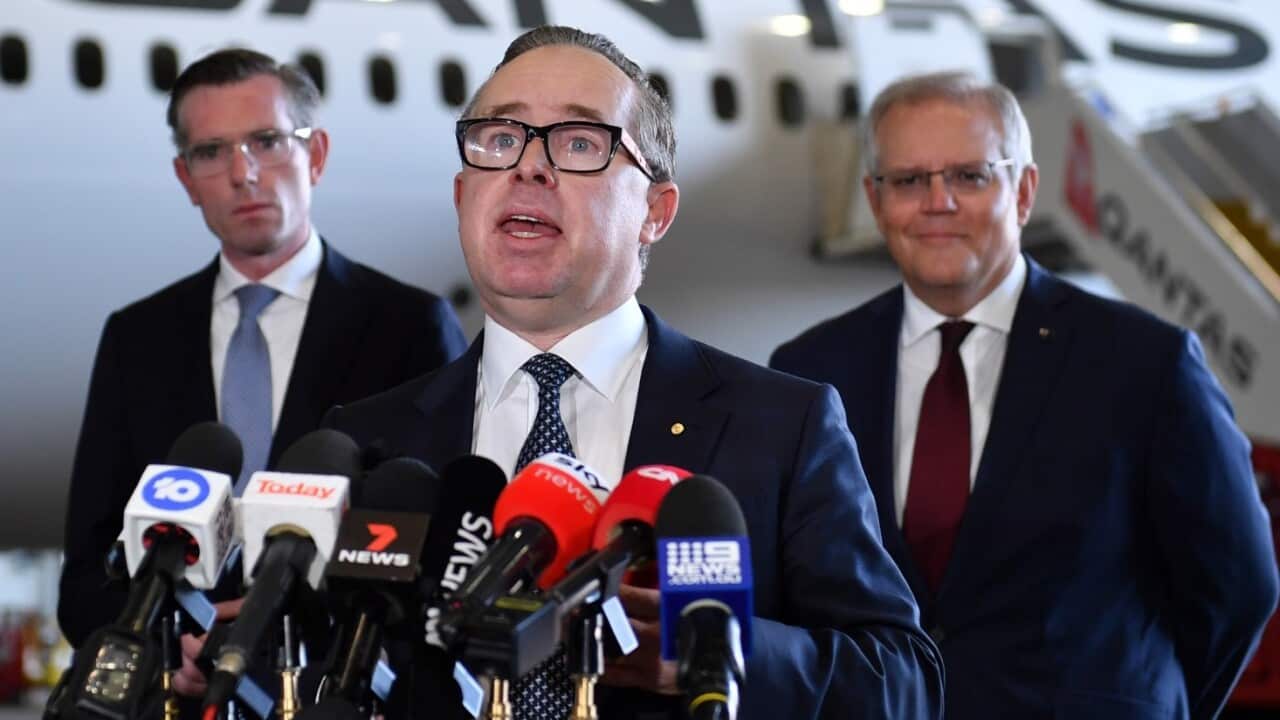 Qantas Group CEO Alan Joyce (centre) with Prime Minister Scott Morrison (right) and NSW Premier Dominic Perrottet (left).