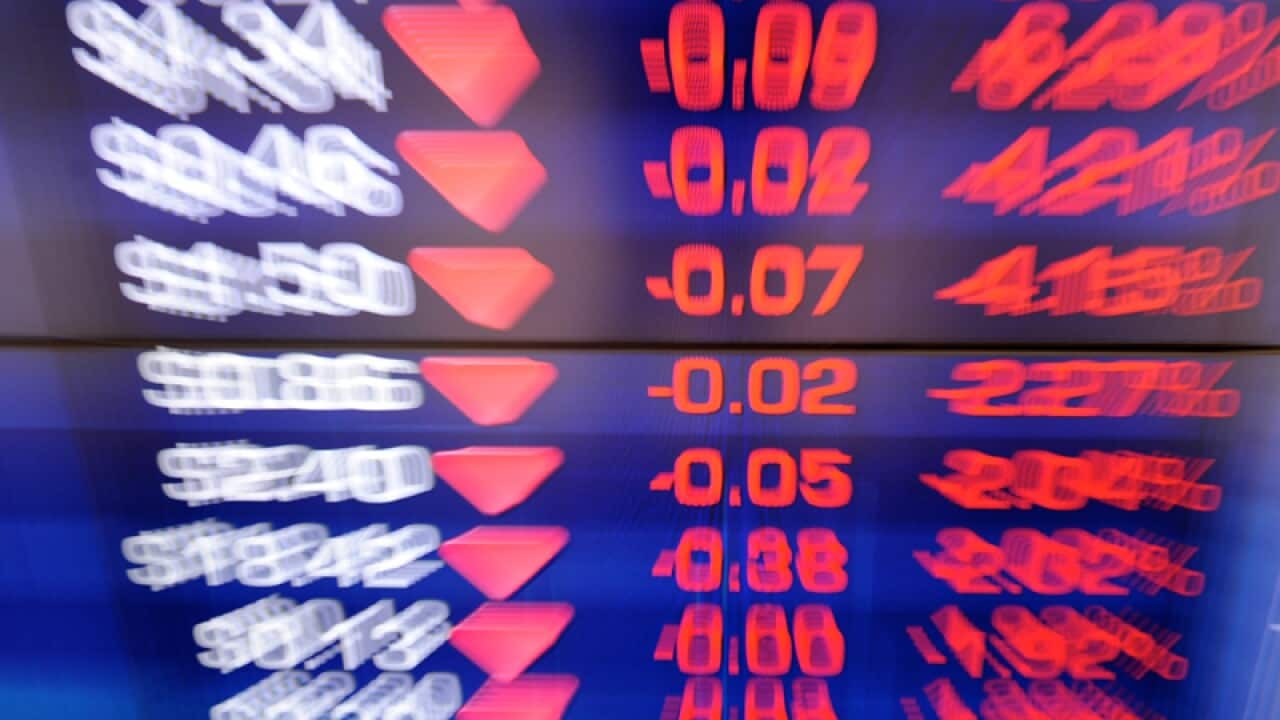 A screen displays stock market.