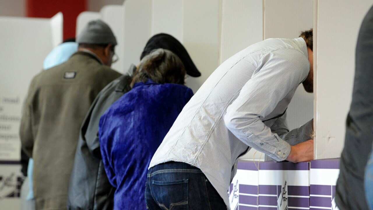 Voters cast their votes in the Federal election