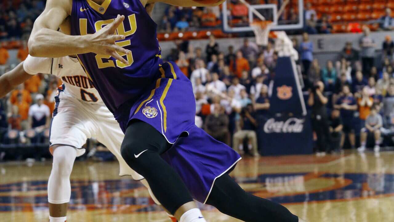 File photo of LSU's Ben Simmons drives to the basket against Auburn during the first half of an NCAA college basketball game in Auburn, Ala.