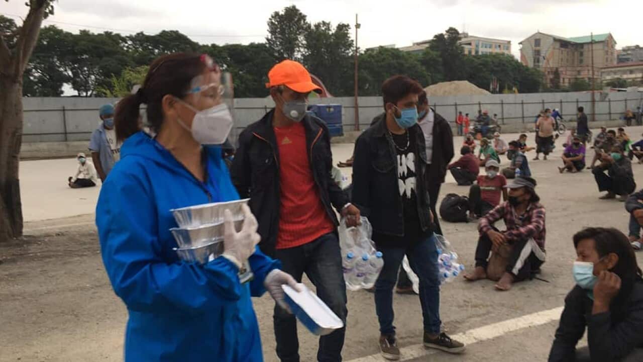 social activist distributing food for the needy