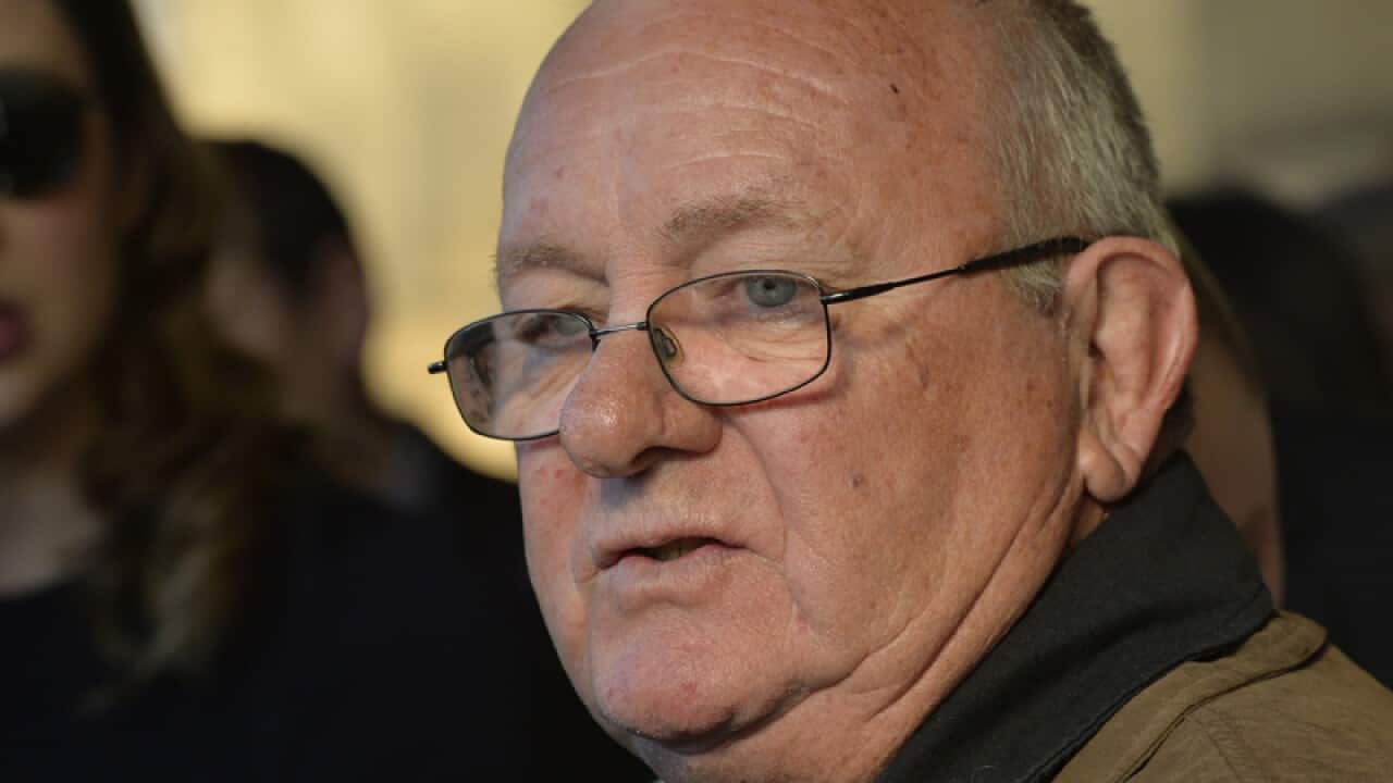 Keith Woodford, surrounded by family and supporters