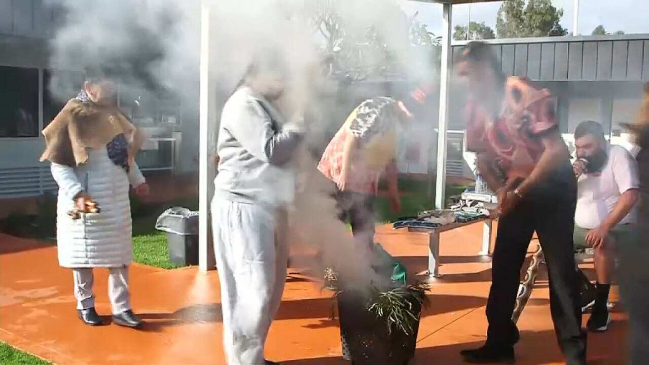 A smoking ceremony as the new facility is opened