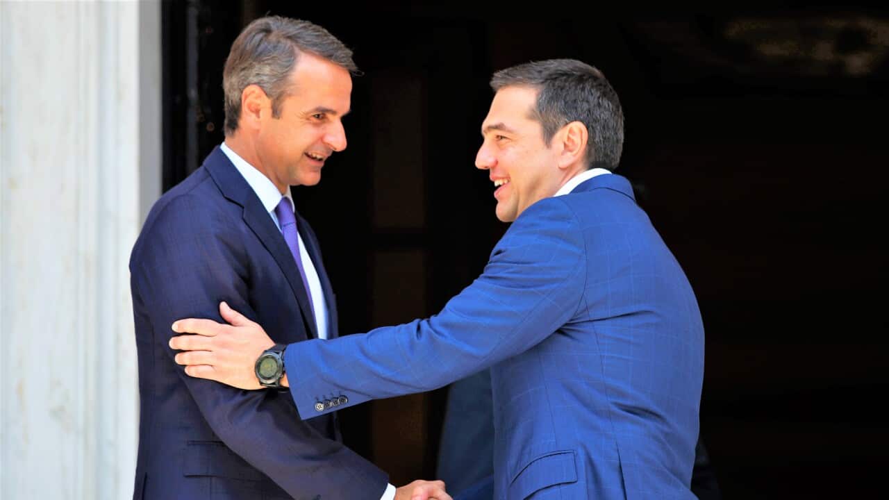 Greece prime minister Kyriakos Mitsotakis, left, with Opposition Leader, minister Alexis Tsipras, right / AP Photo/Thanassis Stavrakis