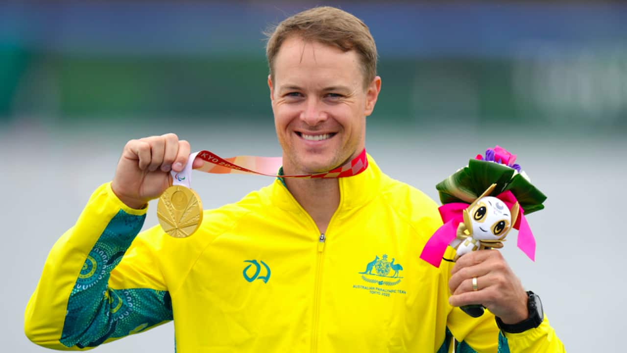 Australia's Curtis McGrath celebrates with the gold medal in the Men's Kayak Single 200m - KL2 Final