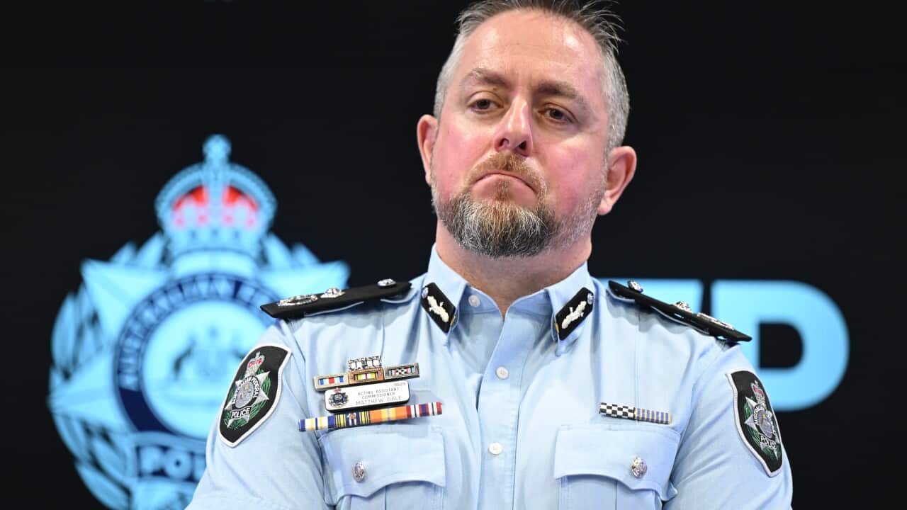 A man in a police uniform.