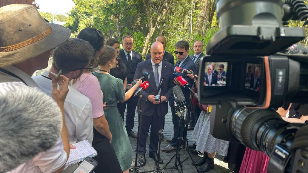 NZ PM Chris Luxon speaking in front of reporters in Waitangi, NZ (SBS)