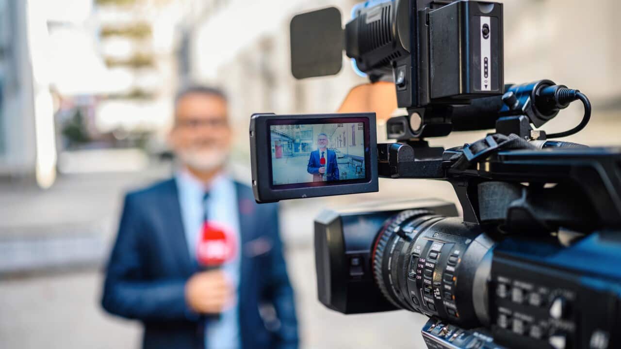 Male TV reporter