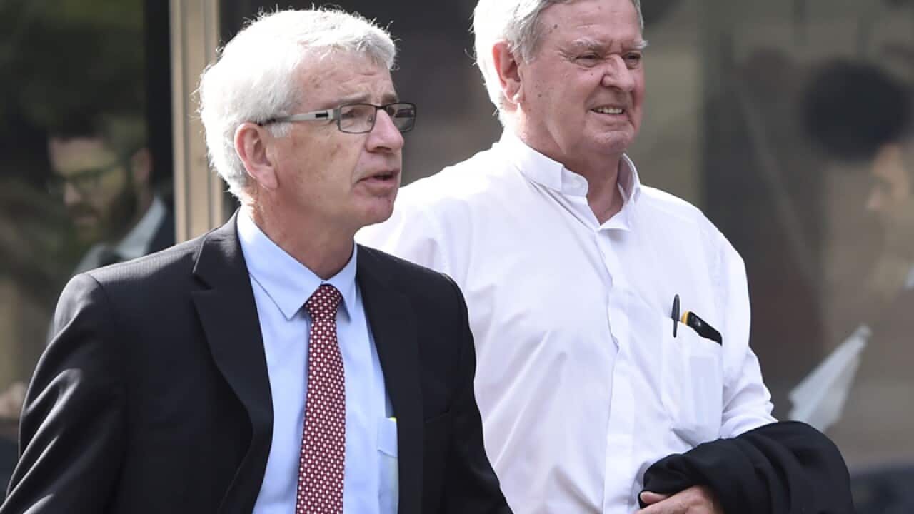 Brisbane auxiliary bishop Brian Finnigan (R)