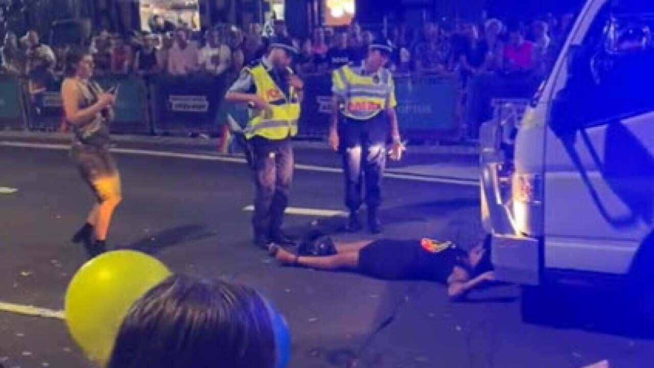 A woman lying on a street