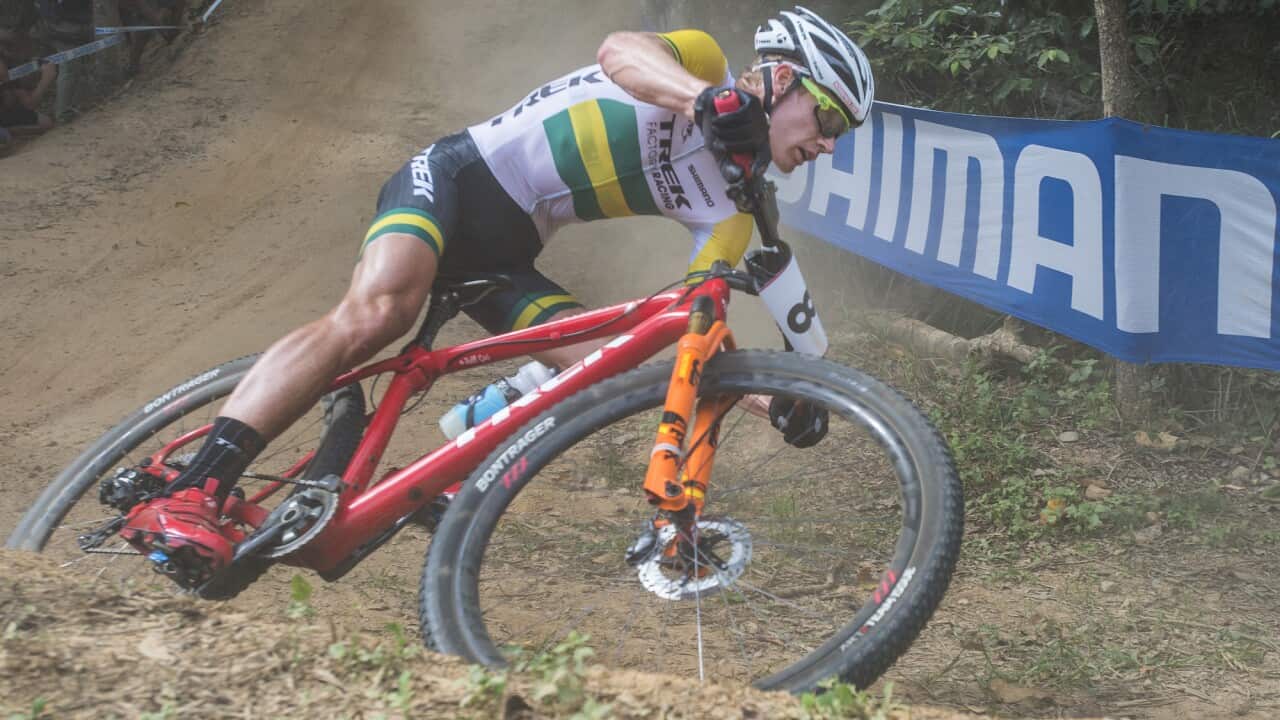 Daniel McConnell from Australia during the Elite Mens Cross Country event at the UCI Mountain Bike World Cup at the Smithfield Regional park in Cairns, Sunday, April 24, 2016.  (AAP Image/Brian Cassey) NO ARCHIVING, EDITORIAL USE ONLY