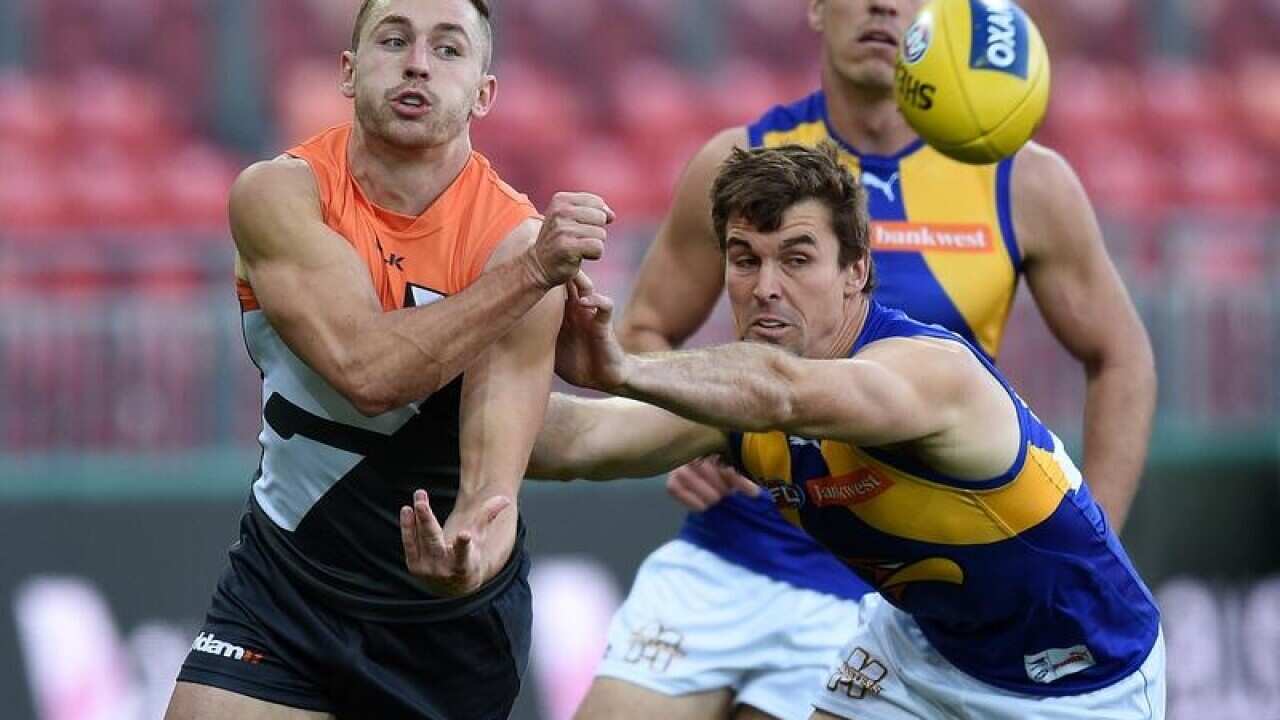 Tom Scully of the Giants competes for the ball.