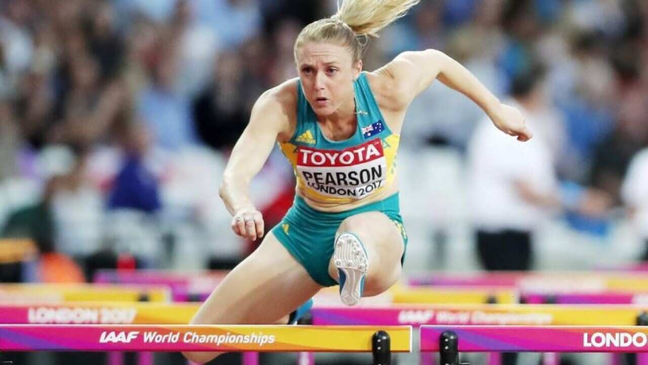 Australia's Sally Pearson clears a hurdle.