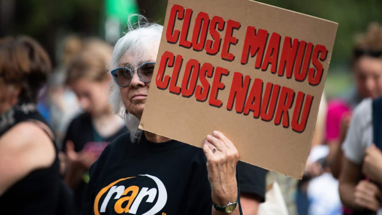 Refugee advocates are seen during Palm Sunday Rally for refugees at Belmore Park in Sydney, Sunday, April 14, 2019. (AAP Image/Paul Braven) NO ARCHIVING